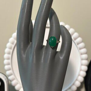 Silver ring with green stone size 6.
